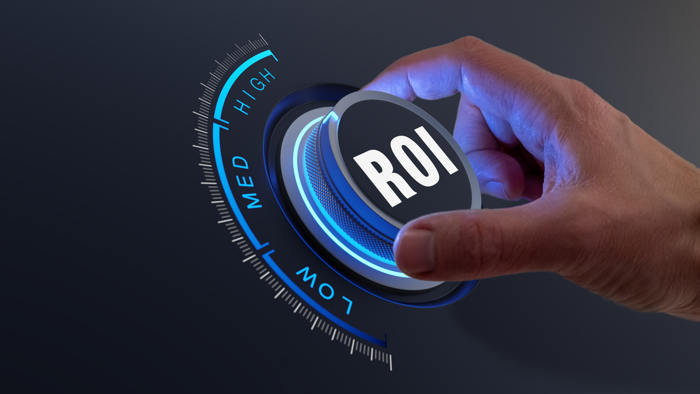 Hand turning dial labeled ROI to increase return on investment